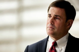 Arizona Governor Doug Ducey listens to presentations during his visit to the University of Arizona Steward Observatory Mirror Lab in Tucson, Ariz., Wednesday, March 11, 2015.